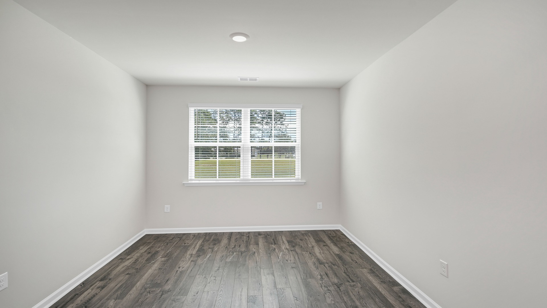 Flex space in the home off the front foyer near the kitchen space