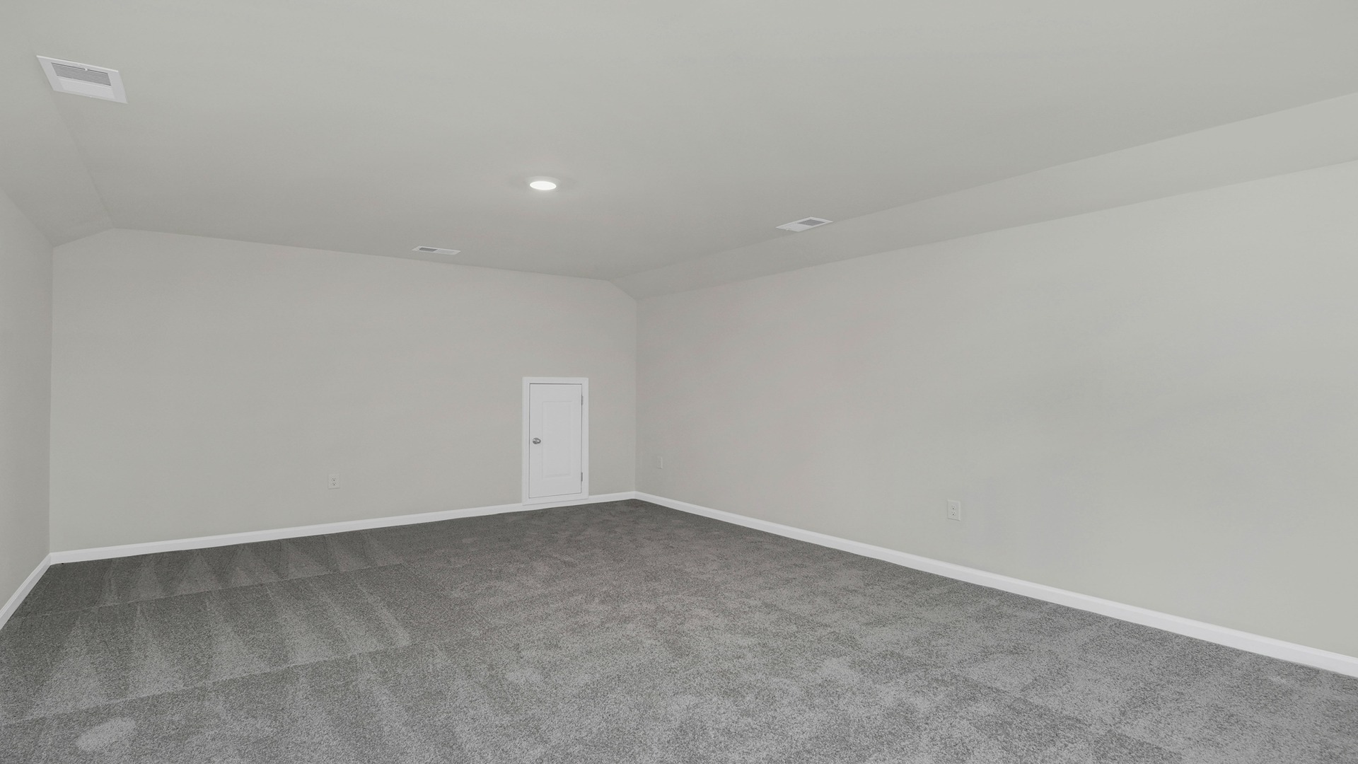 Finished upstairs loft space with carpet flooring