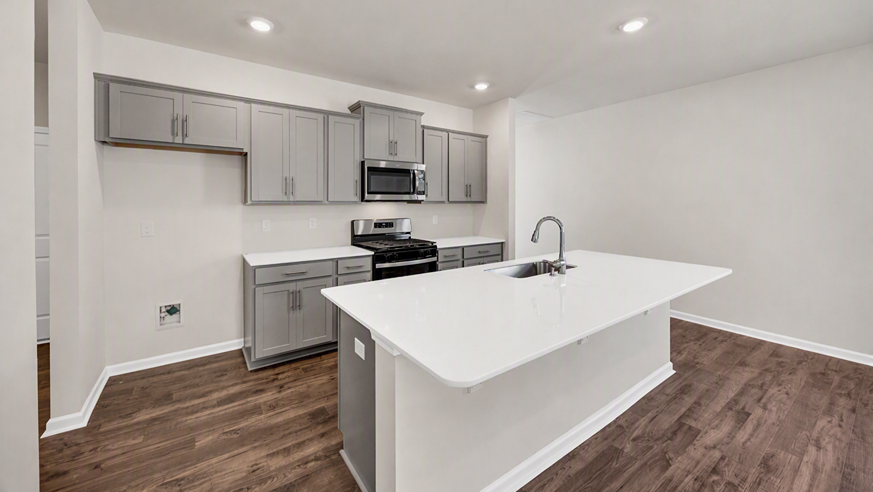 Modern new kitchen in home for sale in Sumter with gray cabients