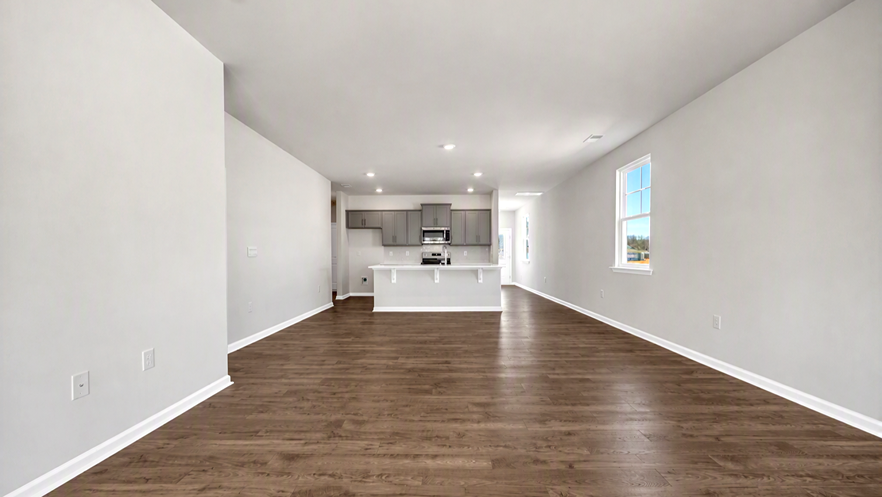 Completely open concept kitchen, dining, and living areas in home for sale in Meadowview Plantation