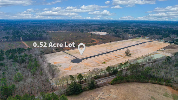Plot of land over a half-acre in size towards the back of the community