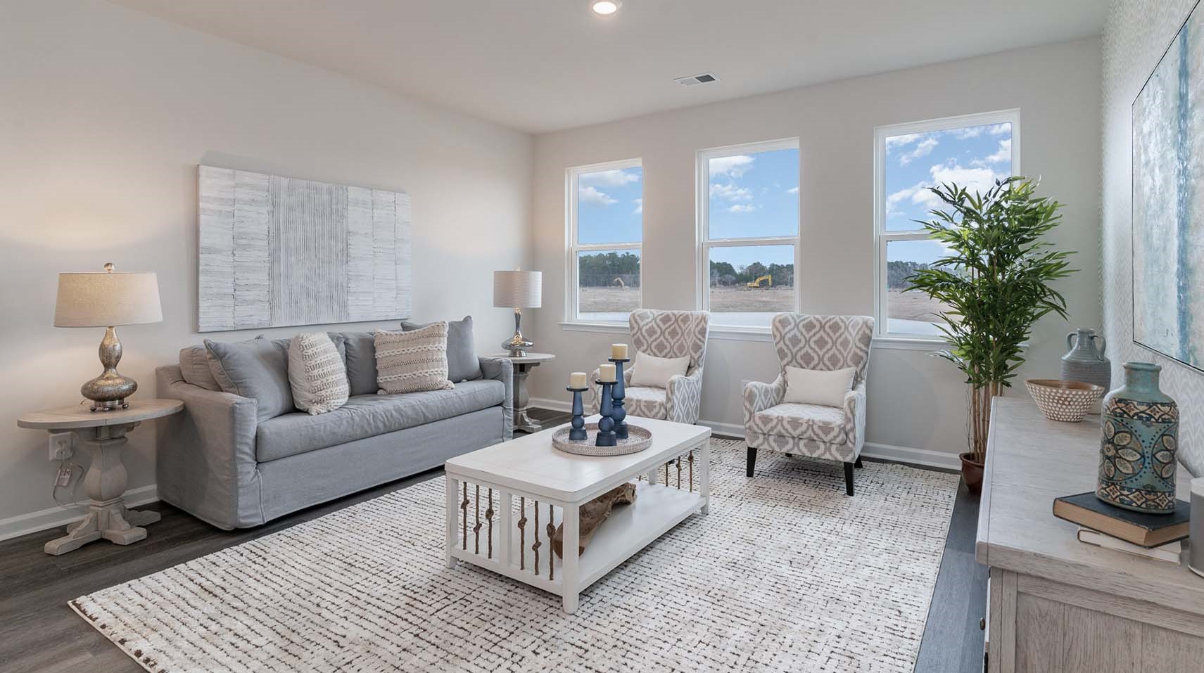 Open living area with lots of natural light in the Dover in Meadowview Plantation