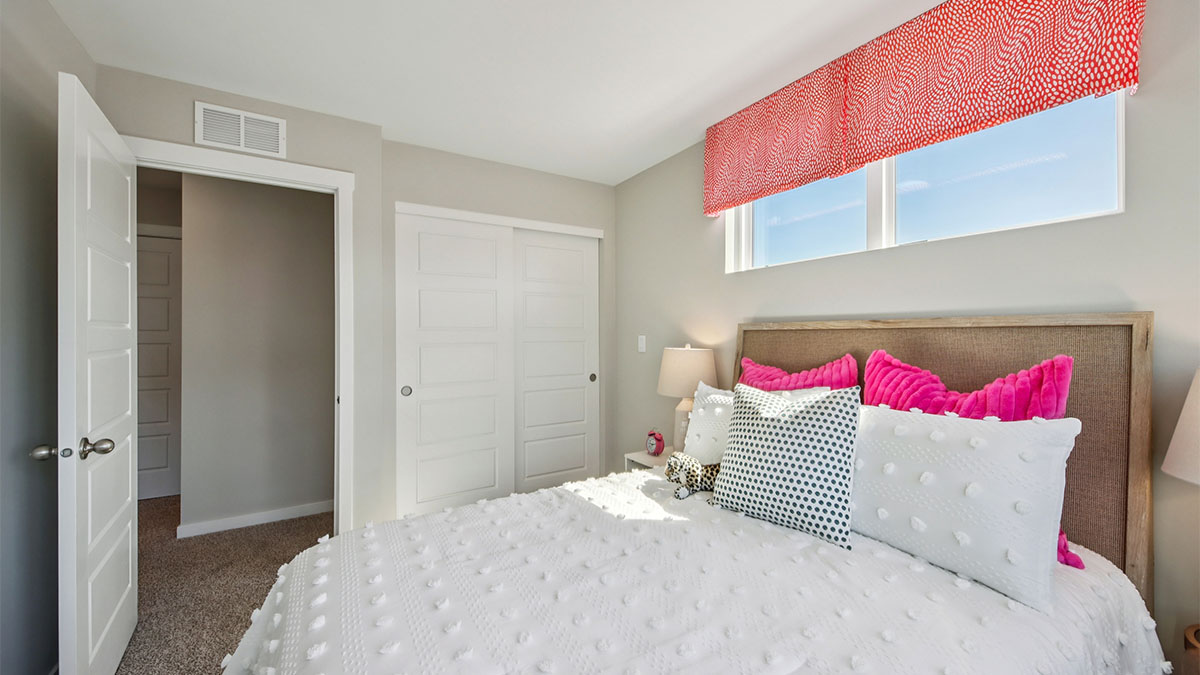 secondary bedroom with full carpet