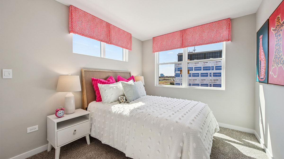 secondary bedroom with full carpet