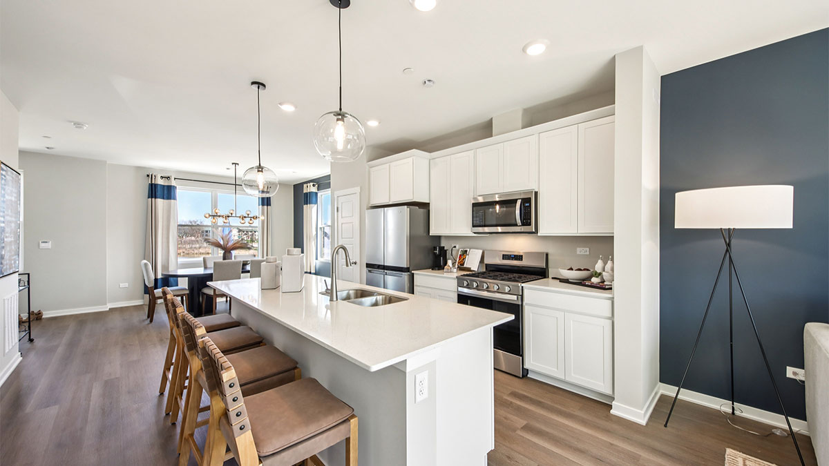 open concept kitchen with white cabinetry