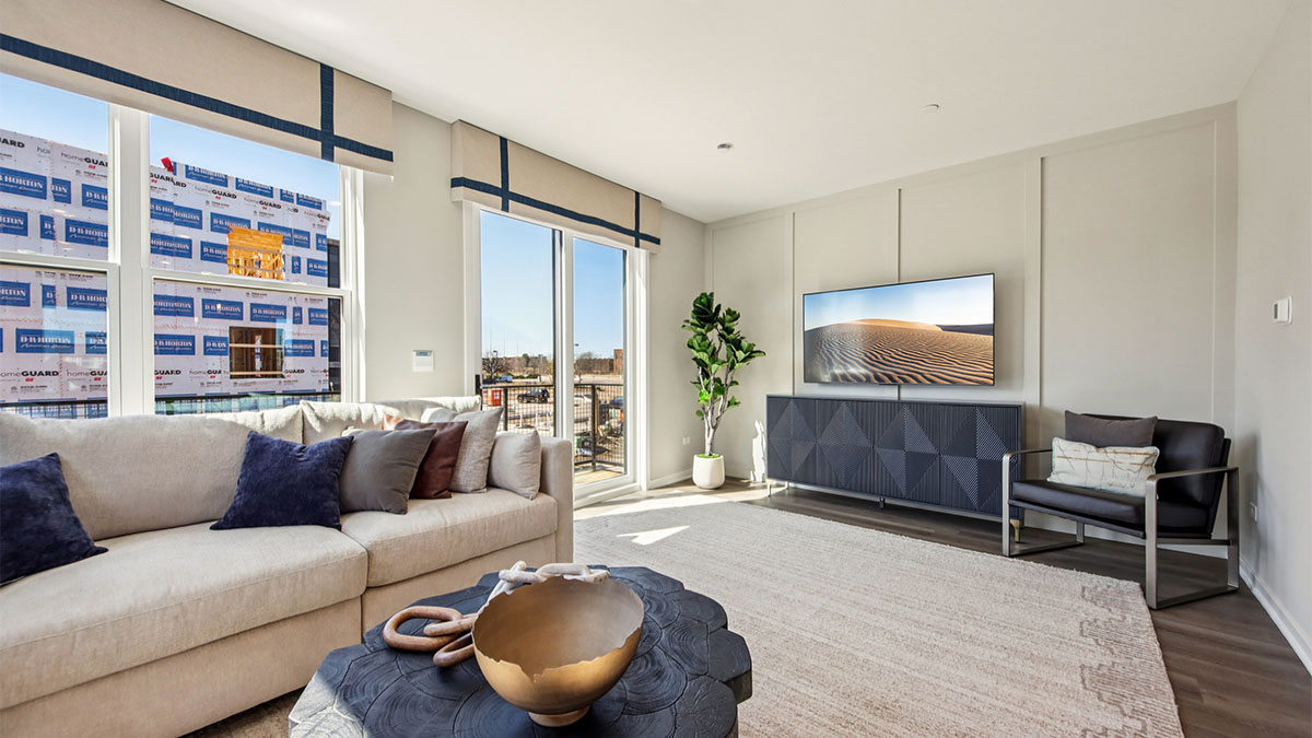 spacious living room with large windows and natural light