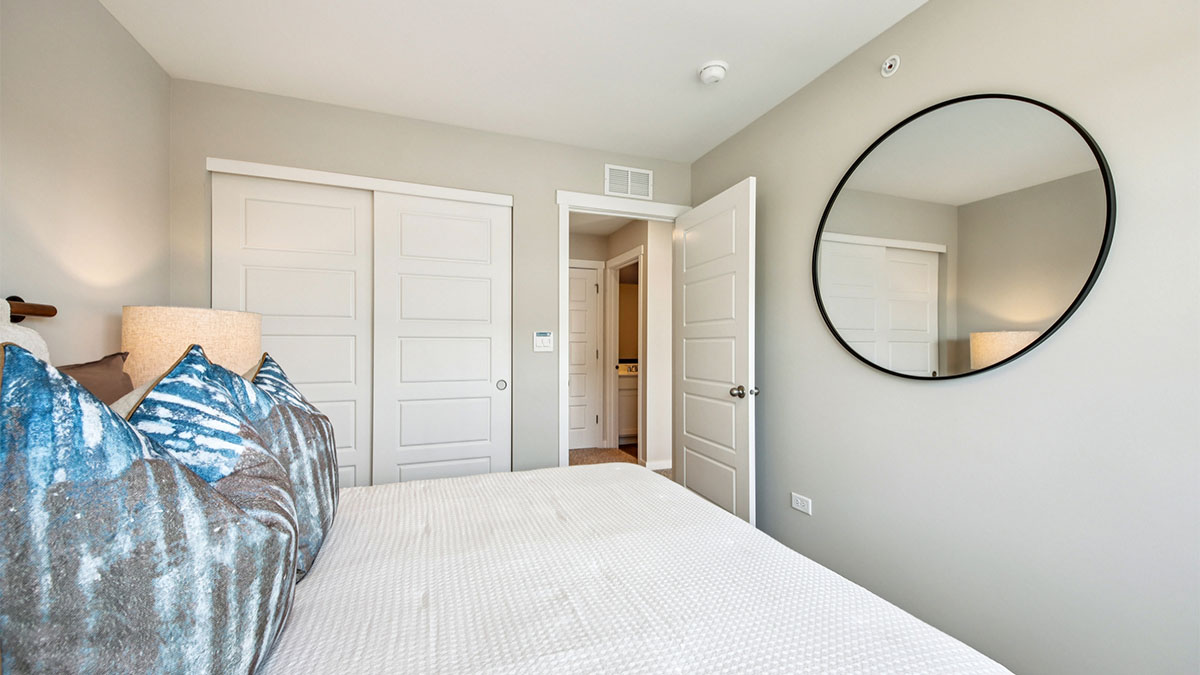 secondary bedroom with full carpet