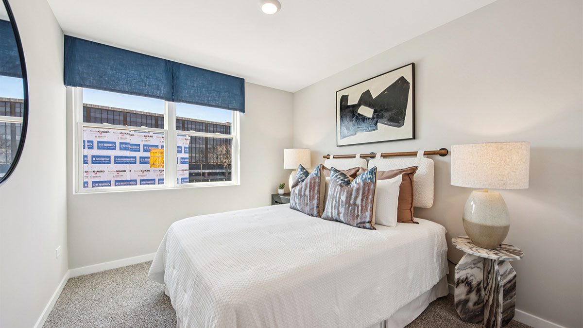 secondary bedroom with full carpet