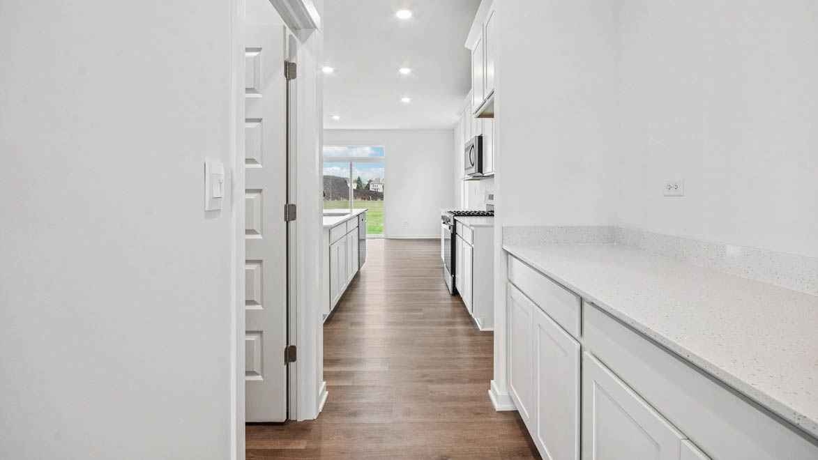 butlers pantry with lower cabinets and countertop
