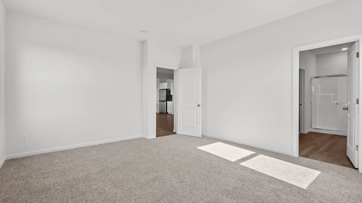 Primary bedroom with connecting en suite