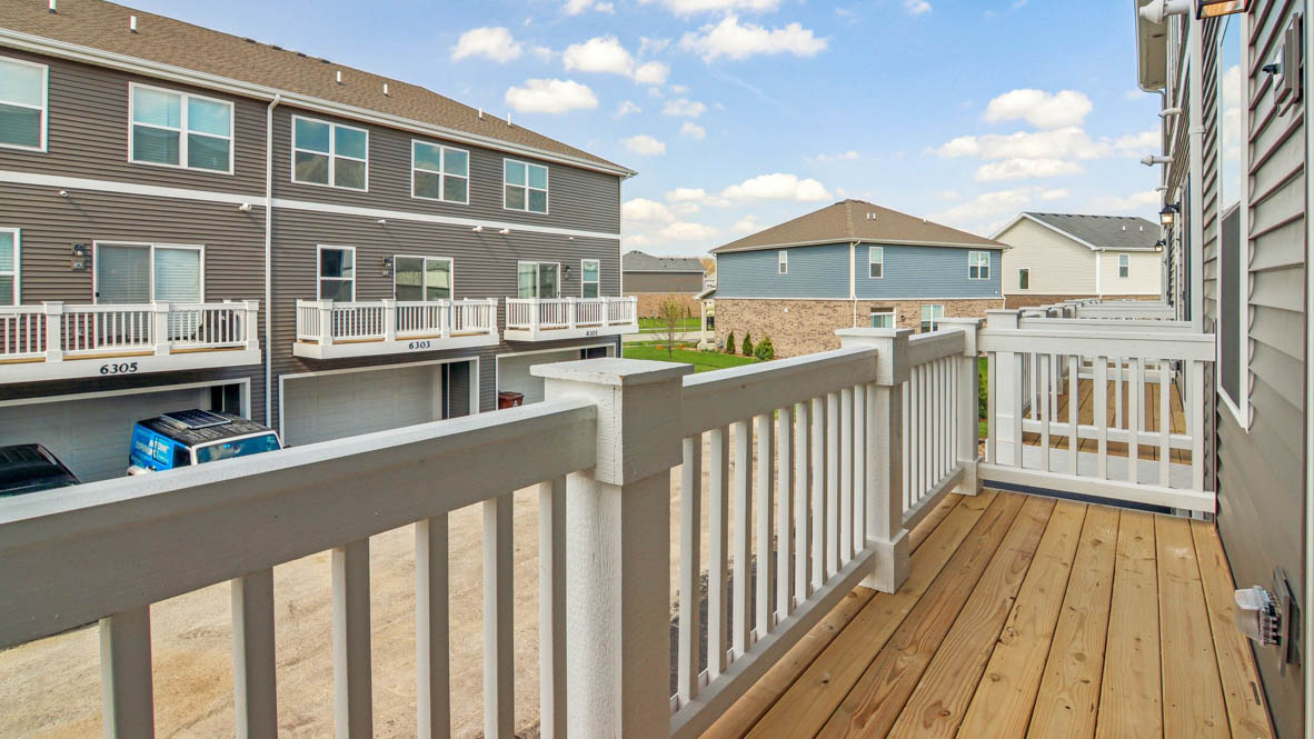 Balcony with white vinyl railings
