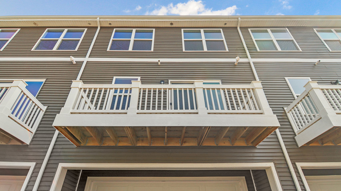 Large balcony with white railing