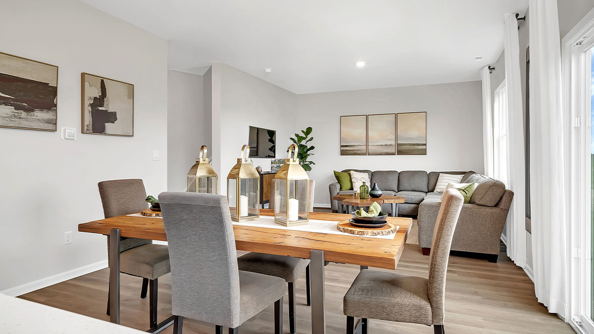 Dining room next to the kitchen featuring a table with six chairs