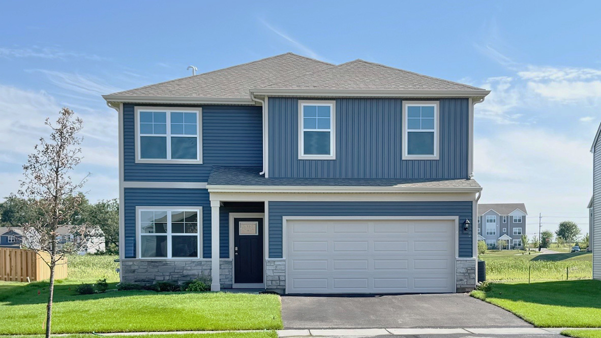 Two story bellamy home with light blue vinyl siding and stone accents