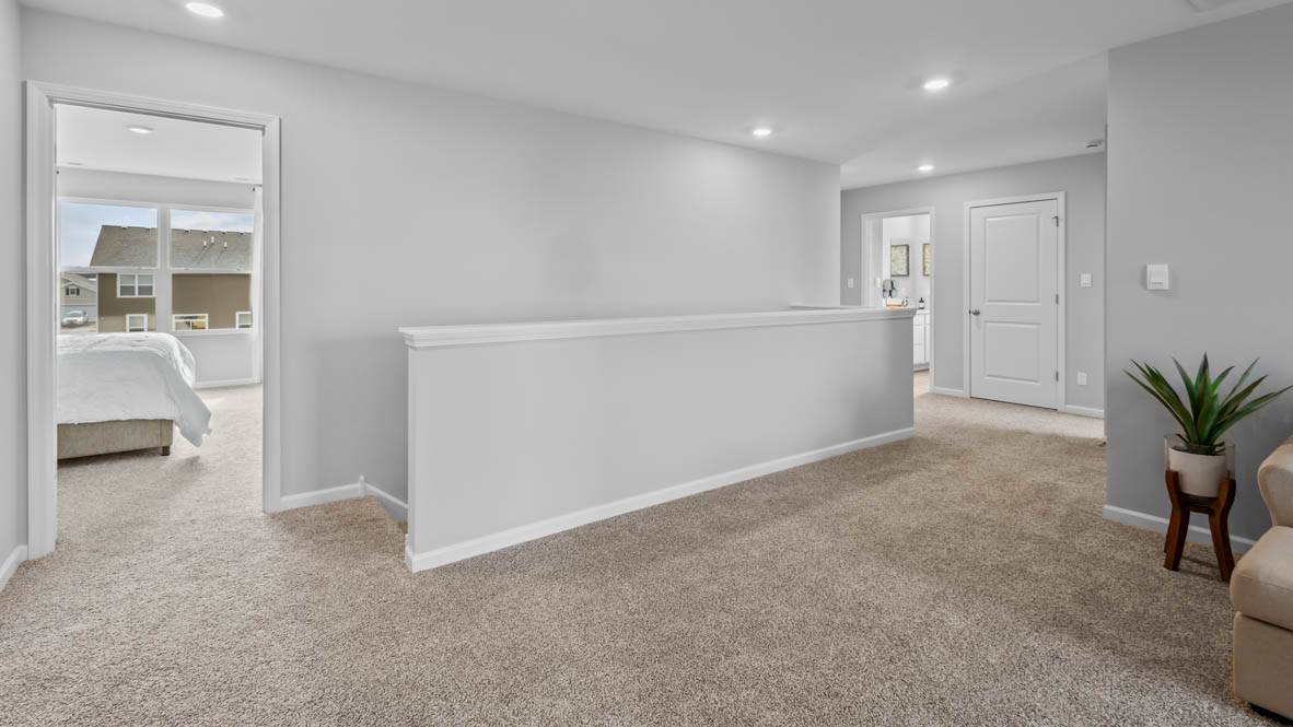 second floor layout with two bedroom on either side of loft