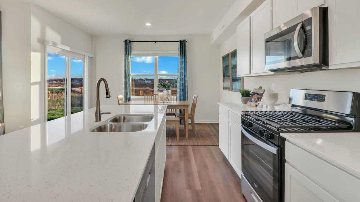 open concept kitchen with access to dining room space