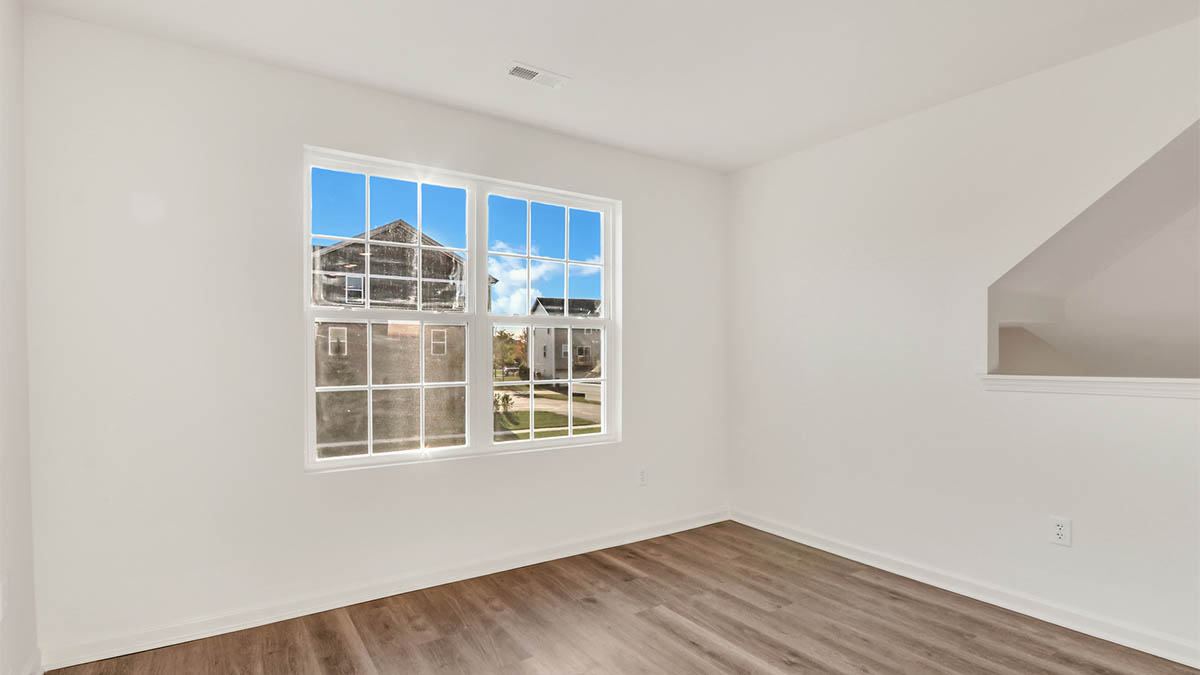 View from kitchen into the dining and living rooms, upstairs, near outdoor access