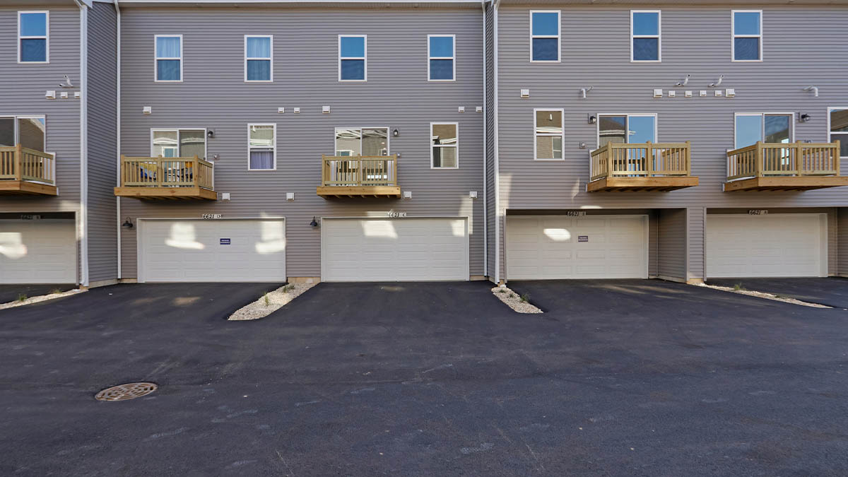 New build home with garage and garage door by D.R. Horton featuring access to two-car garage