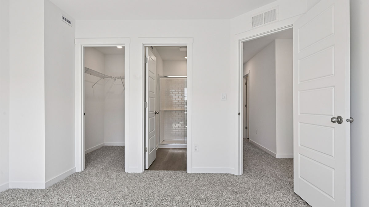 Primary bedroom with connecting en suite and walk in closet