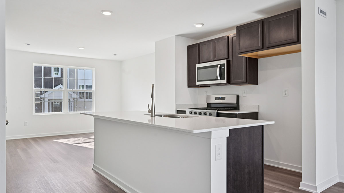 Kitchen in between dining room and great room