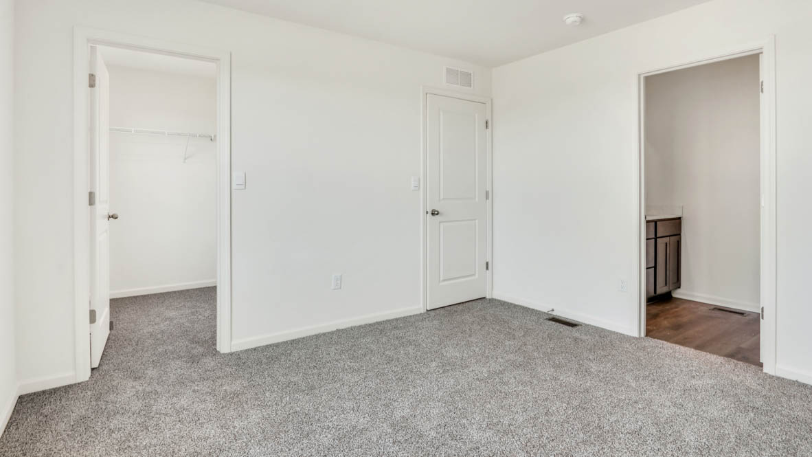 Primary bedroom with connecting en suite