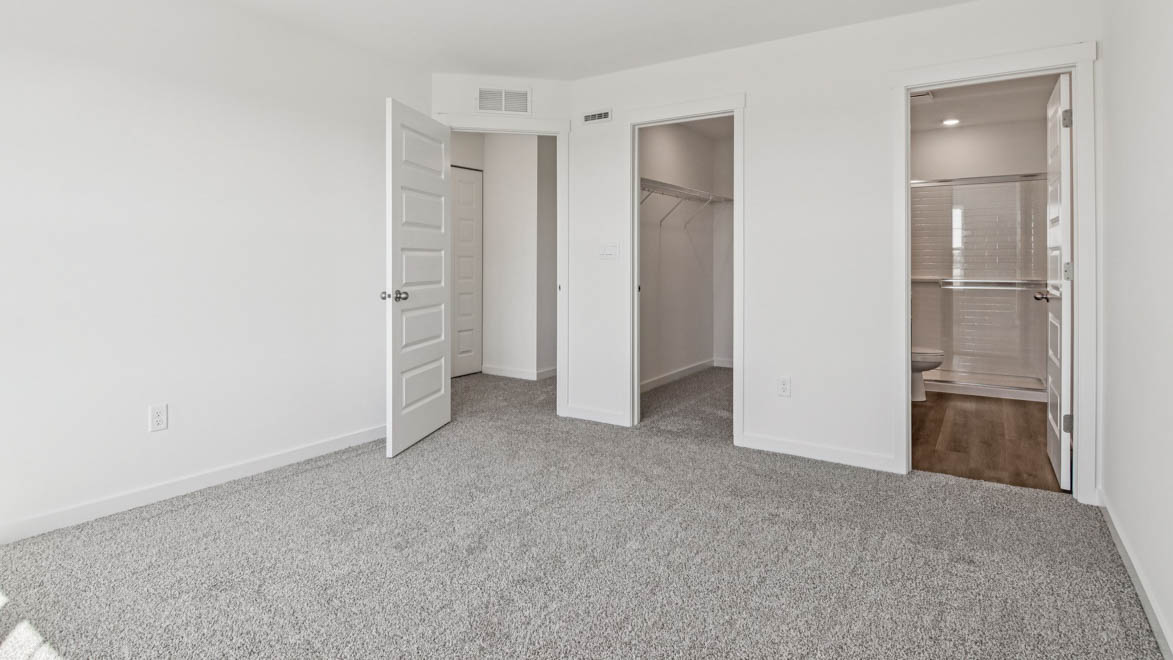 Owner’s suite offers natural window light, spa-inspired ensuite bathroom, backyard view, walk-in closet for everyday style