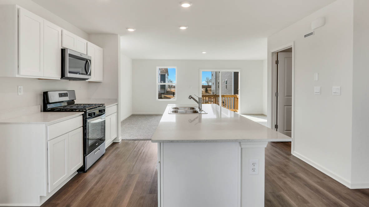 kitchen with white cabinets and white quartz countertops