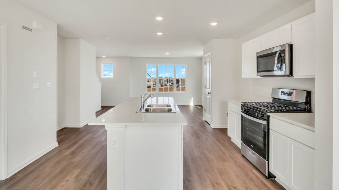 Kitchen in between great room and dining room