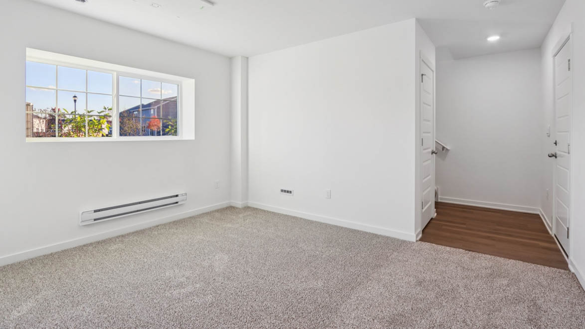 Lower level garage entrance into bonus room