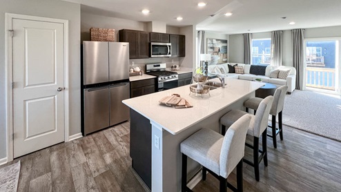 Open concept kitchen with stainless steel appliances