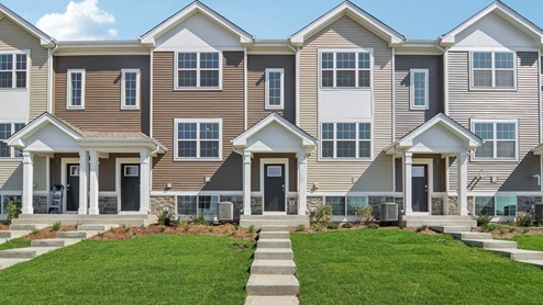 New Homes in Pingree Grove tri level townhome with vinyl and stone siding