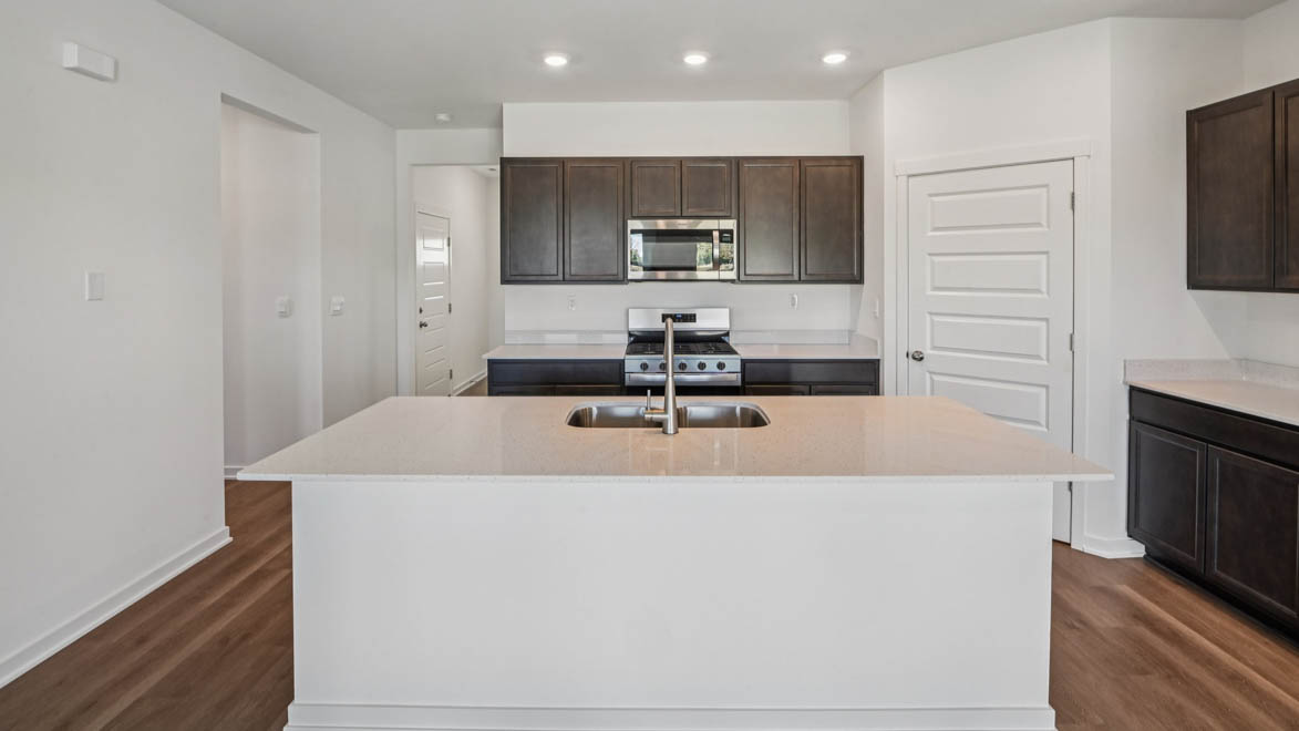 Kitchen with large island overlooking dining room