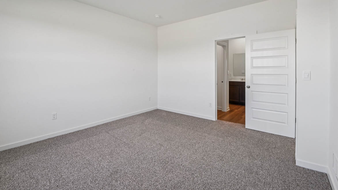 Primary bedroom with connecting en suite