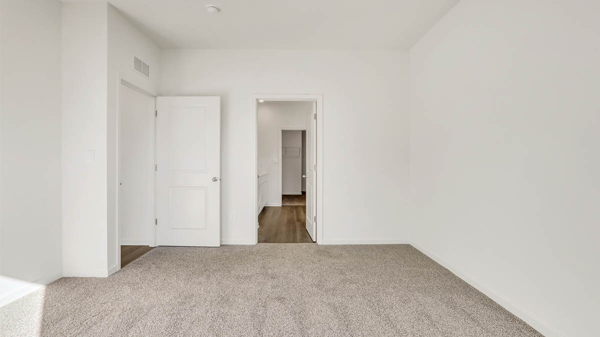 Primary bedroom with connecting en suite