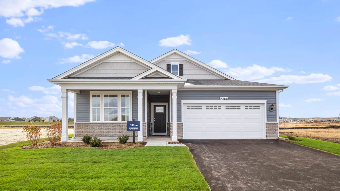 C2 exterior og ranch clifton with blue vinyl siding and brick accents
