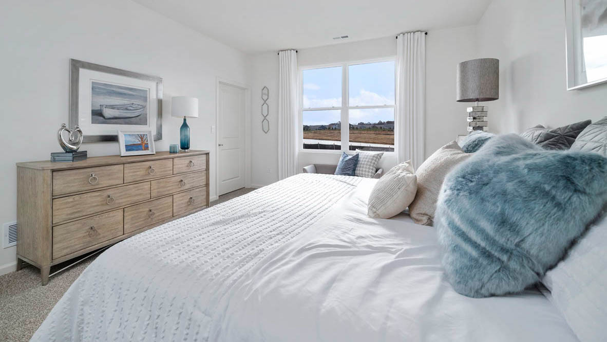 Clifton model primary bedroom with queen size bed