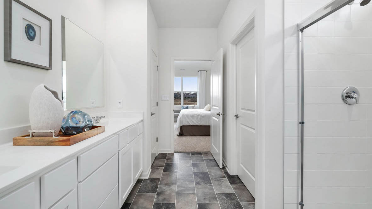 Primary bathroom with walk in shower and water closet