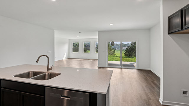 Interior kitchen with center island open to living area