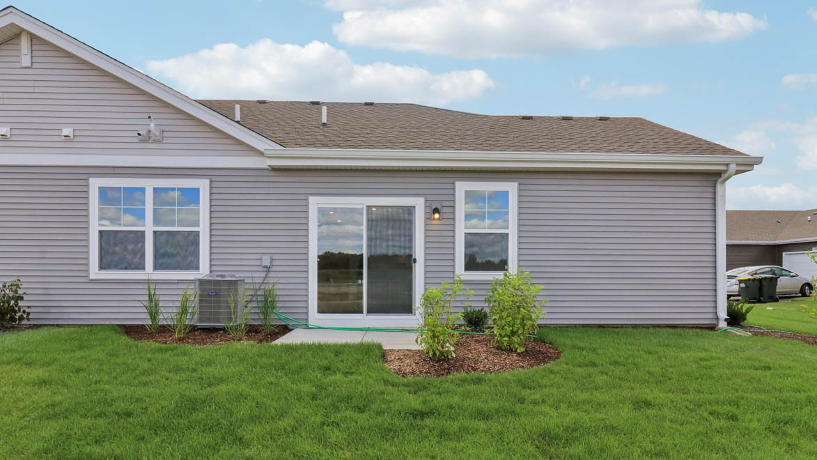 Back of home with patio