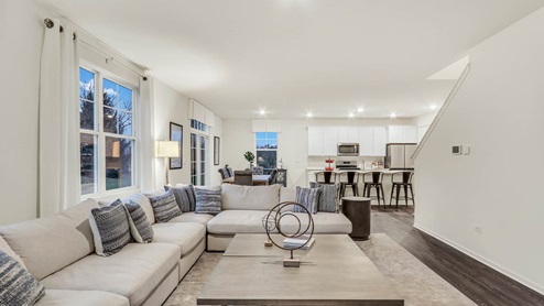 living room interior with view of kitchen