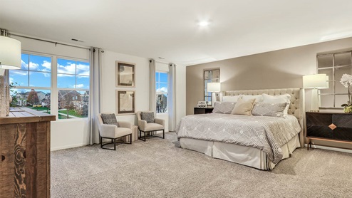 primary bedroom with attached bathroom