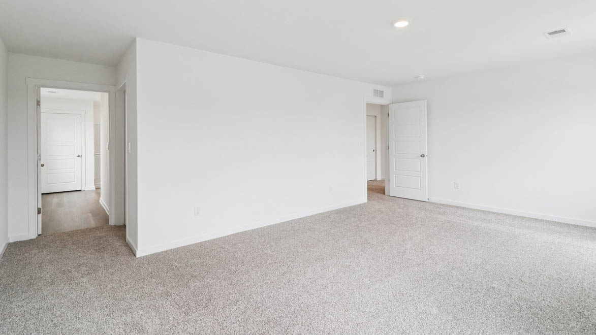 Primary bedroom with connecting en suite