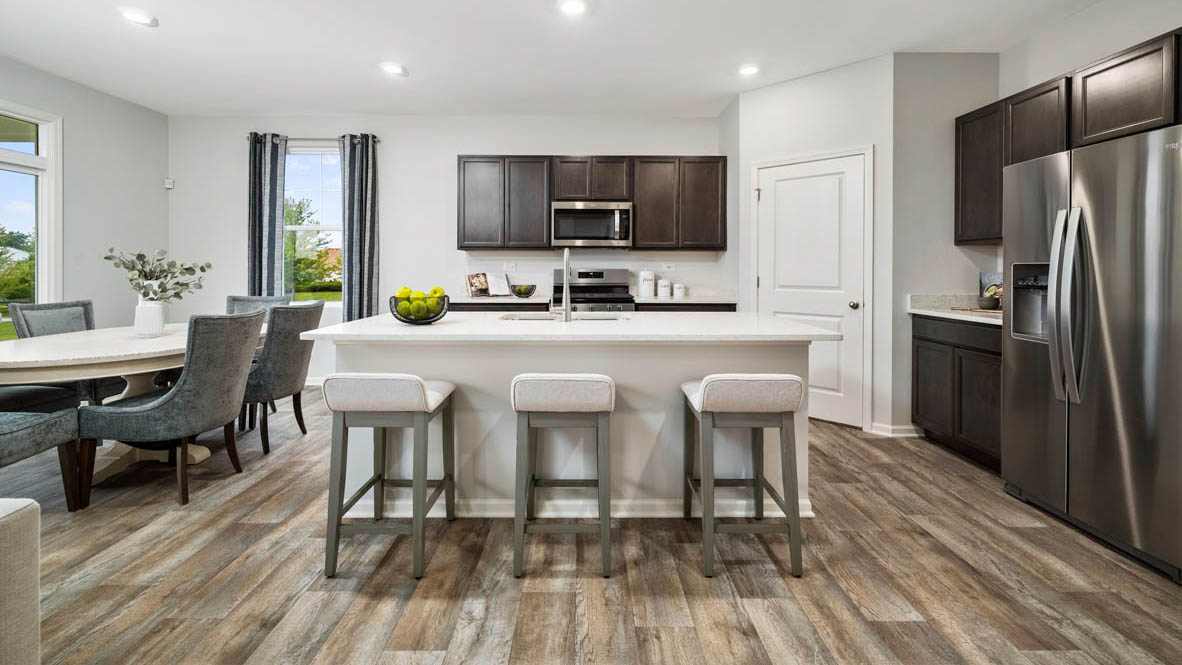 Kitchen with dark cabinets and white quartz countertops