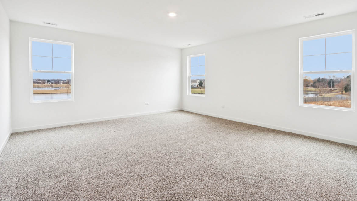 primary bedroom with carpet