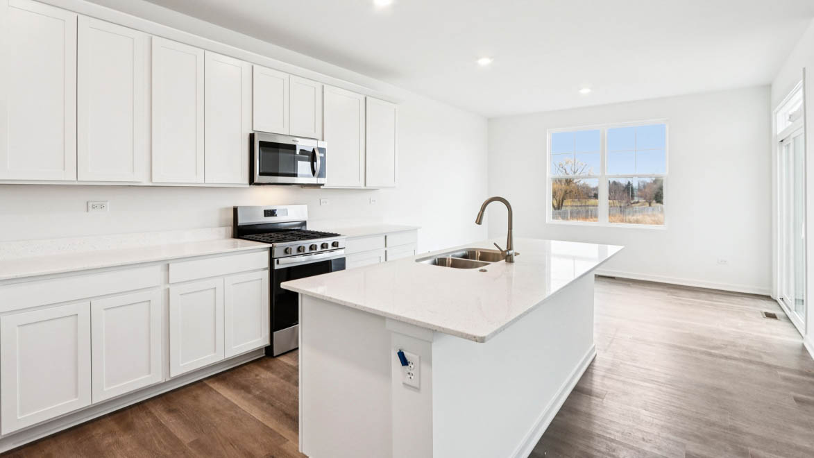 kitchen with white cabinets and white quartz countertops