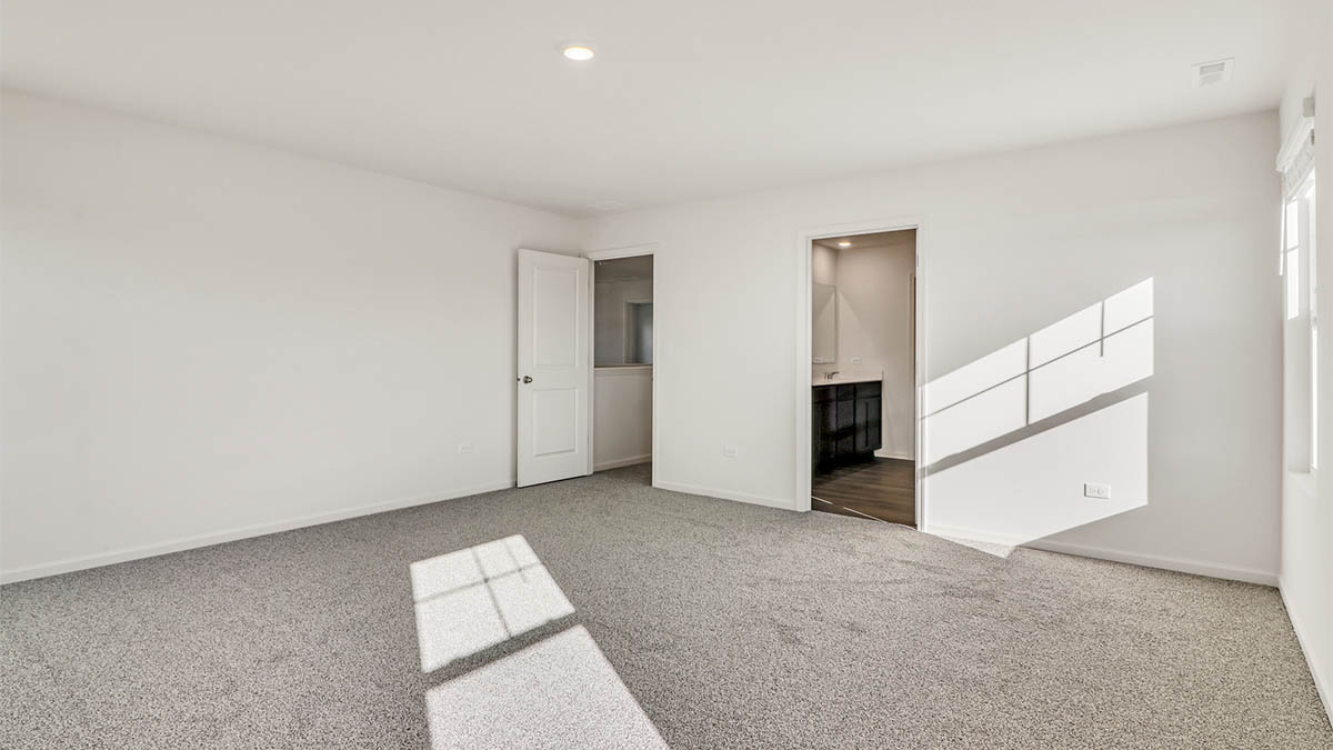 primary bedroom with connecting en suite