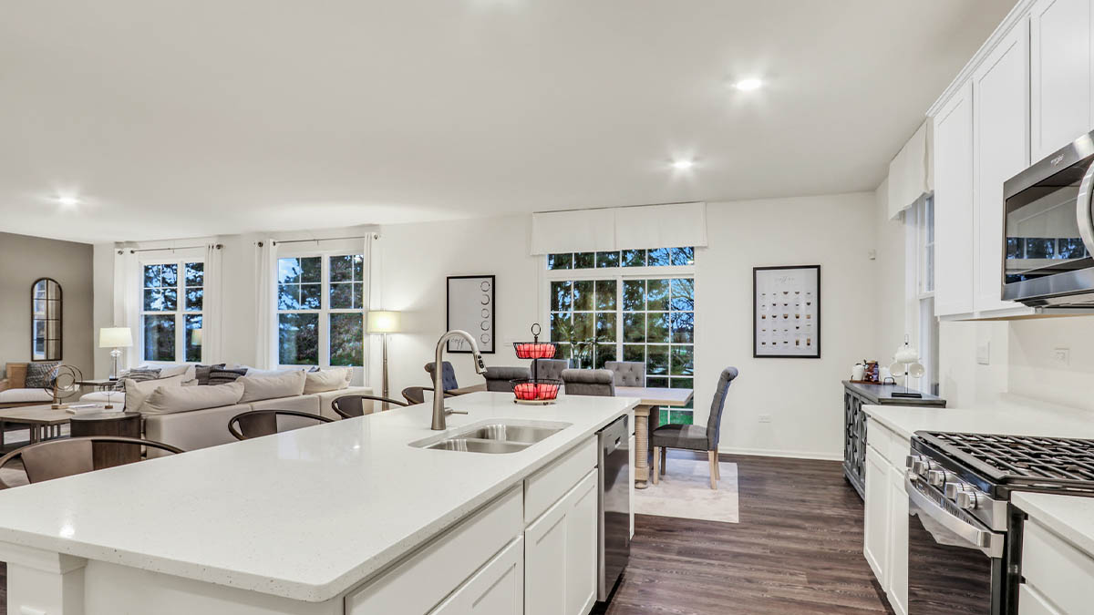 Kitchen with white cabinets and white quartz coutnertops