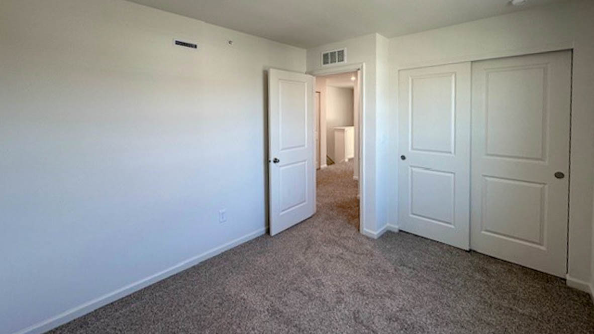 Secondary bedroom, flex-office, study, entertainment, game, craft room options in this D.R. Horton new construction home