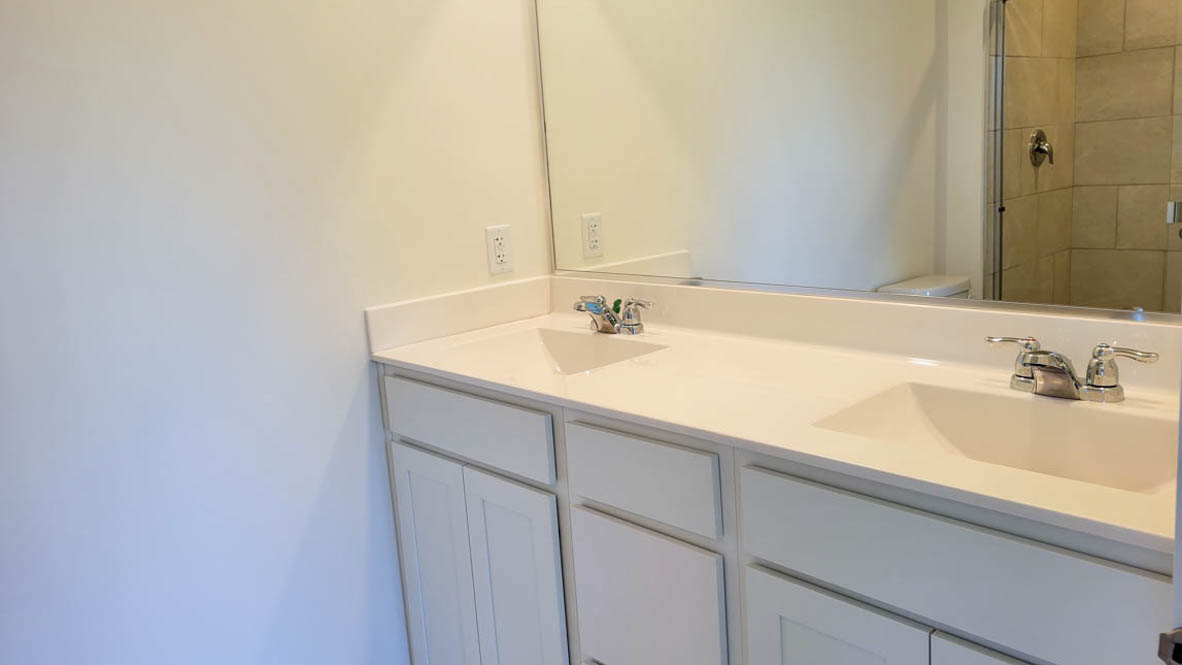 Owner’s ensuite in a new build home offers function and style with a walk-in closet, spa-like ensuite