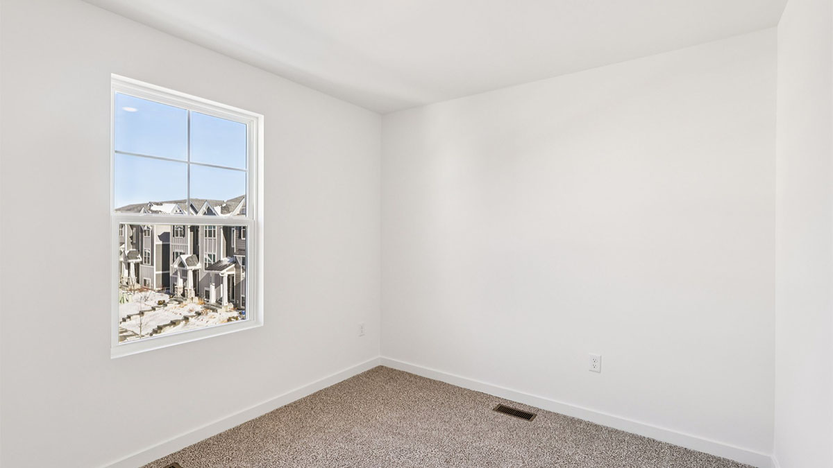 bedroom with carpet and window
